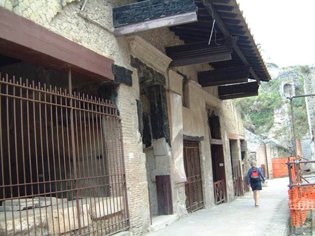 VI.12 Herculaneum, on left. May 2001. Looking west along north side of insula, on Decumanus Maximus. Photo courtesy of Current Archaeology.